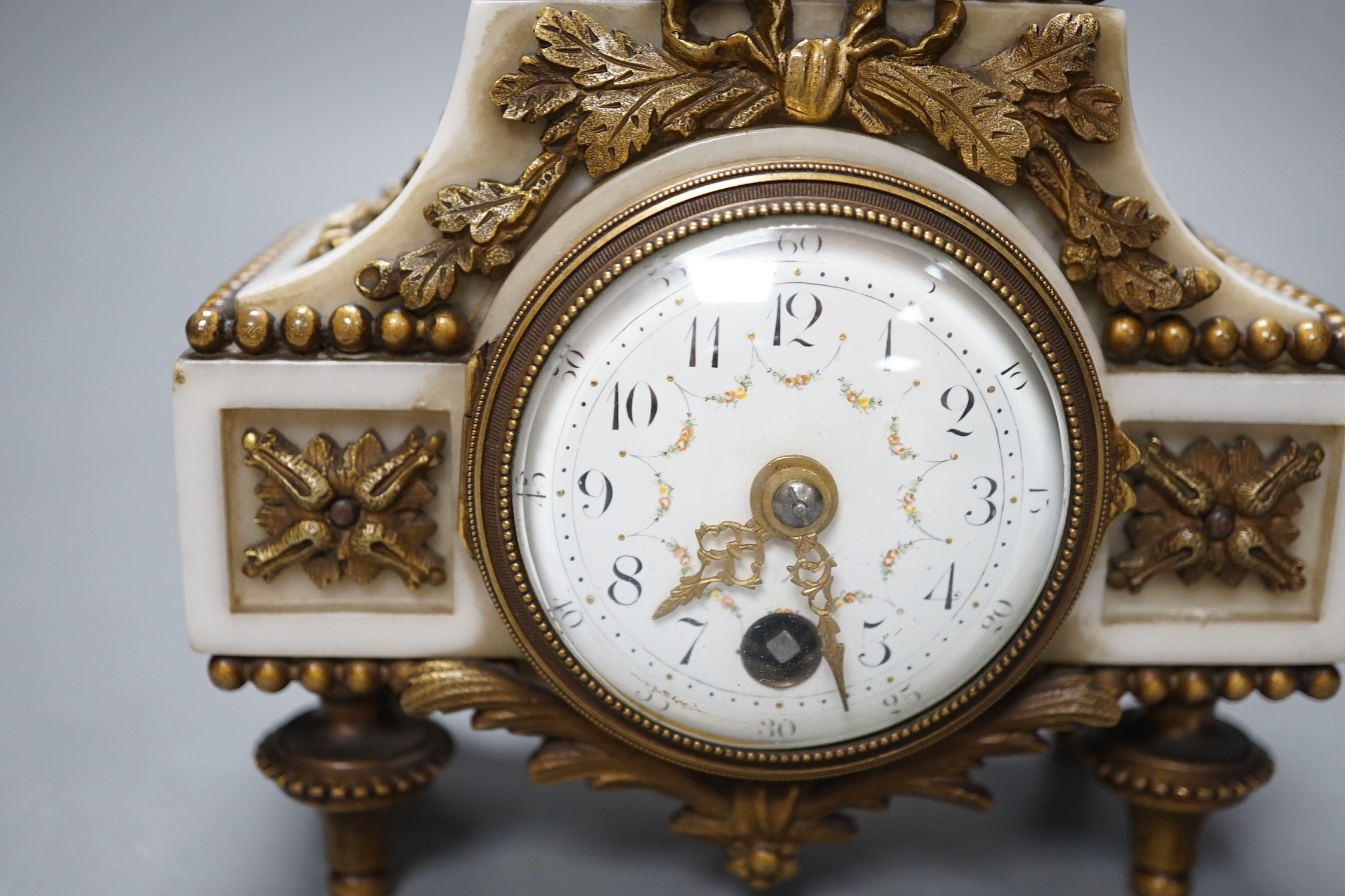 An early 20th century French marble and ormolu cherubic timepiece, height 19cm